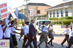 Pastor Greg Baldeo of the Mandeville SDA Church and his members marching for a safer community