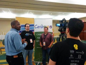 Carlos Martinez (second from left), chief technology officer of the regional Internet registry for Latin American and the Caribbean (LACNIC) and Mark Korsters, chief technical officer of the American Registry of Internet Numbers (ARIN), talk with media at CaribNOG 8, Hilton Curacao, Willemstad, September 30. Photo courtesy: LACNIC.